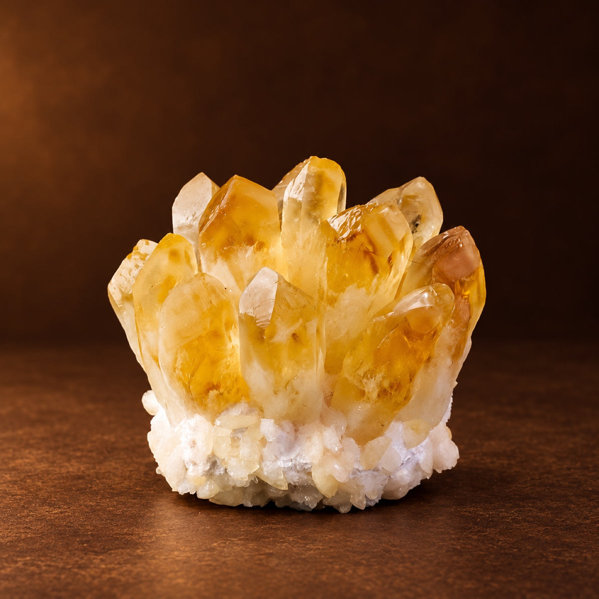 Golden (color-enhanced) dense quartz crystal cluster on a display base