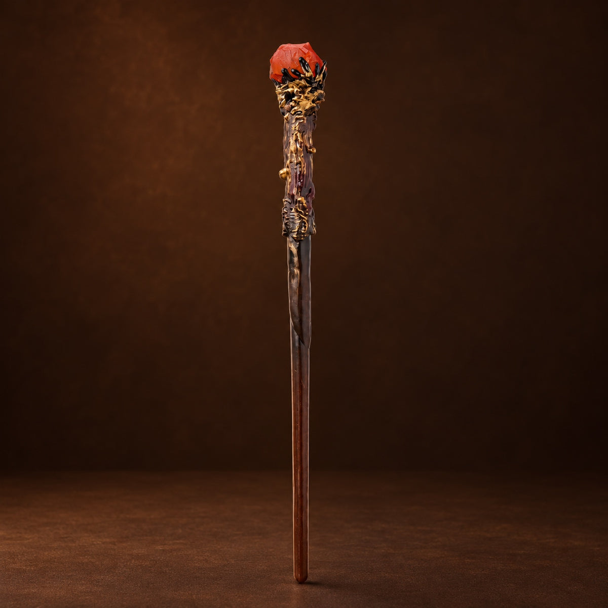 Magic wand topped with Red Jasper in a gold-tone setting