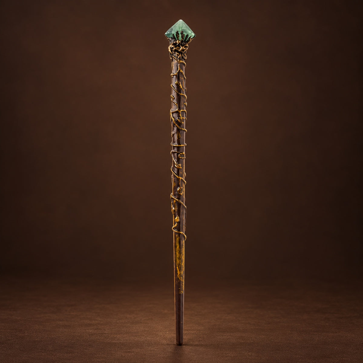 Magic wand topped with Fluorite Octahedron in a gold-tone setting