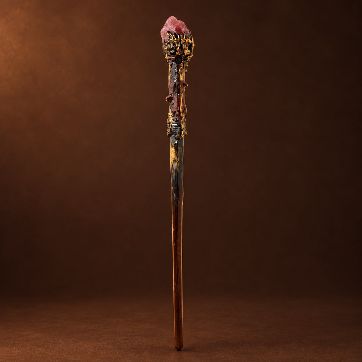 Magic wand topped with Strawberry Quartz in a gold-tone setting