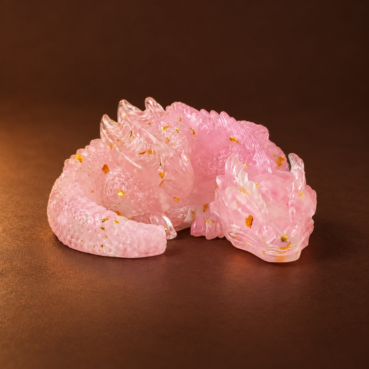 Resin sleeping dragon figurine with Rose Quartz chips and gold flakes