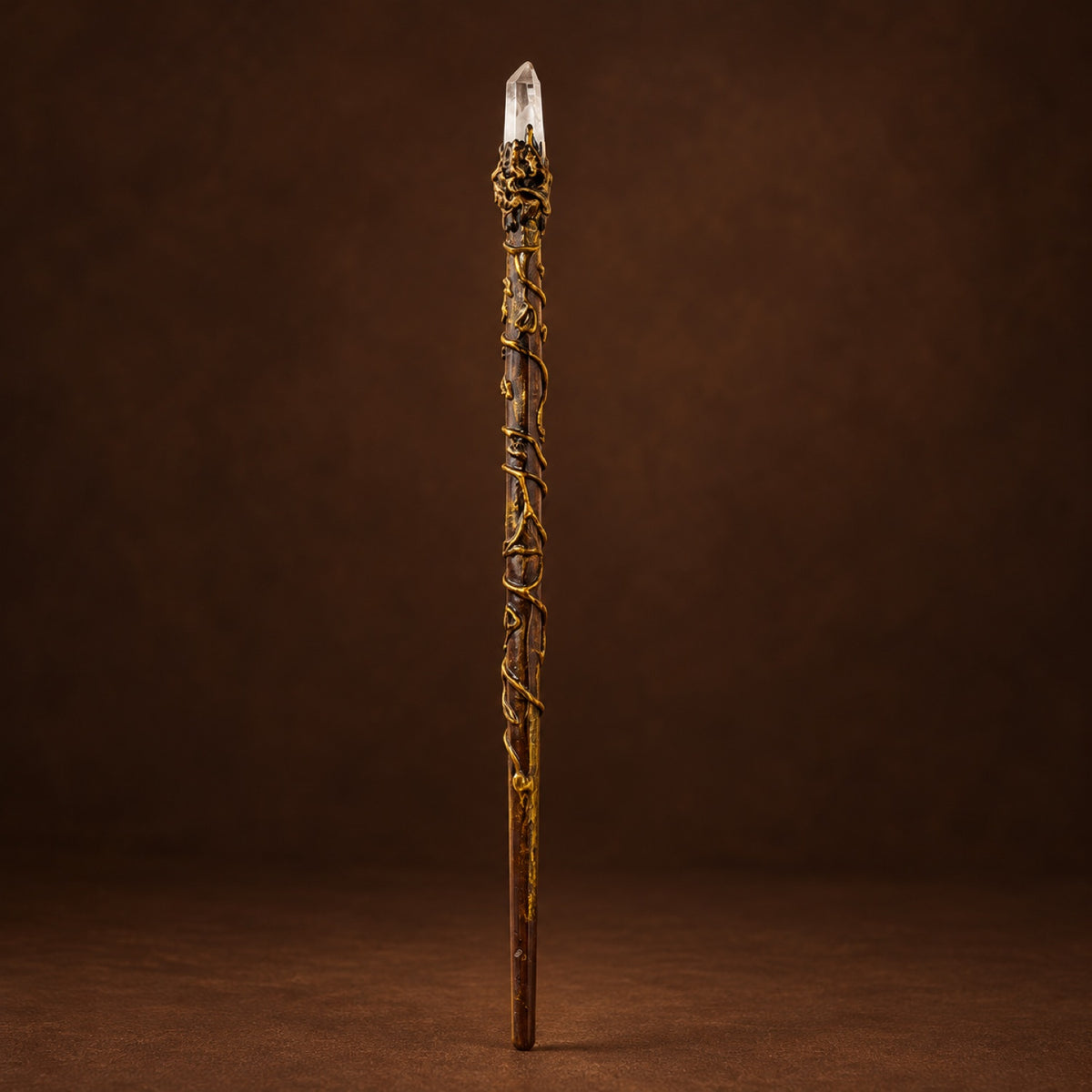 Magic wand topped with Clear Quartz Point in a gold-tone setting