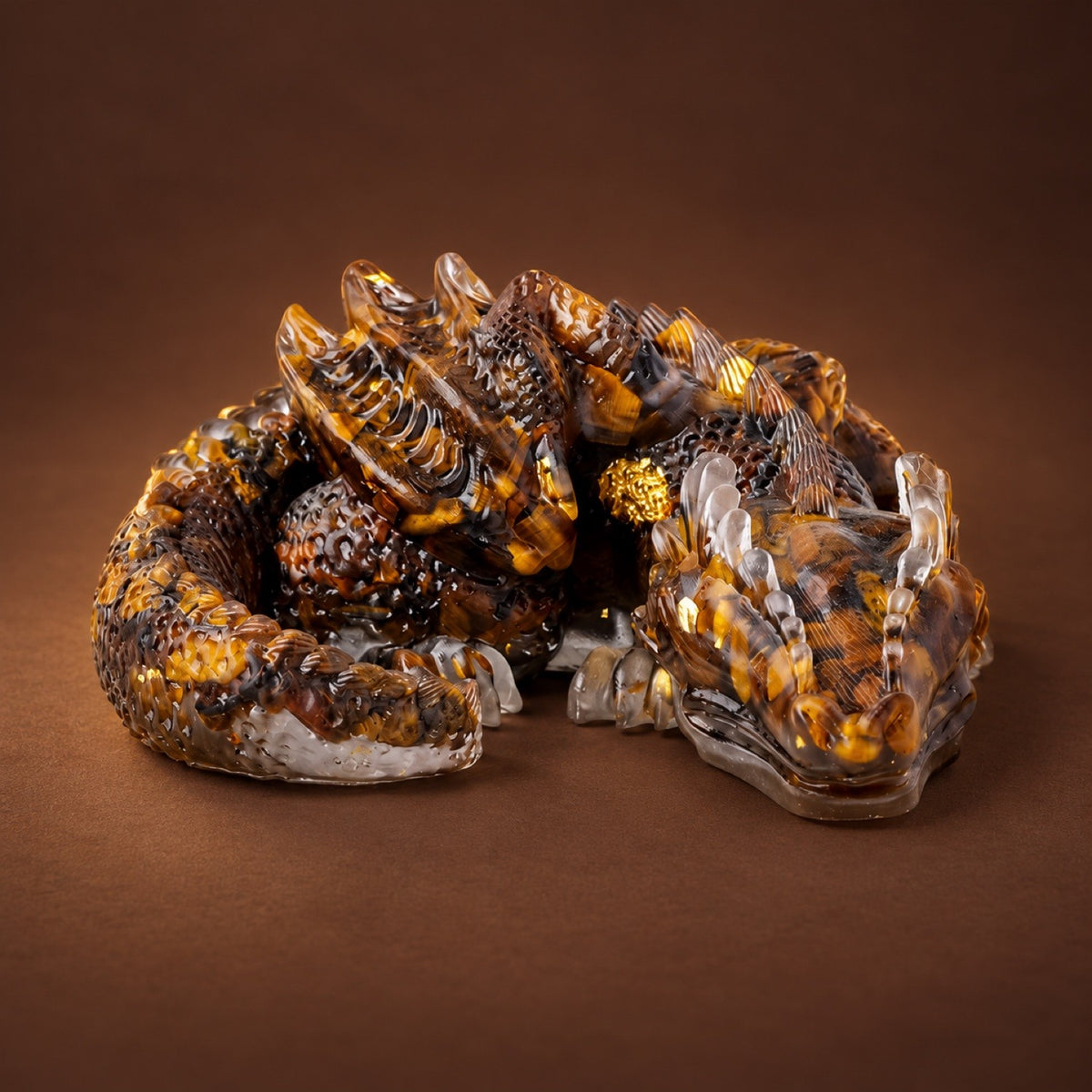 Resin sleeping dragon figurine with Tiger's Eye chips and gold flakes