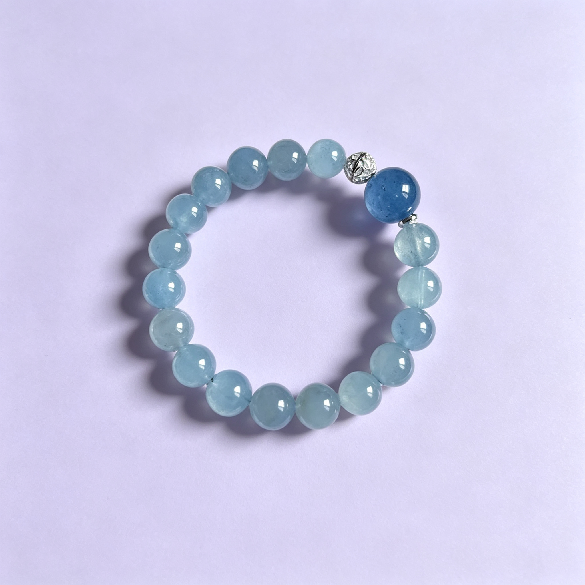 Retouched photograph of bracelet 005: pale blues · a deeper blue accent